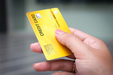 Man holding several credit cards and he is choosing a credit card to pay and spend Payment for goods via credit card. Finance and banking concept.	
