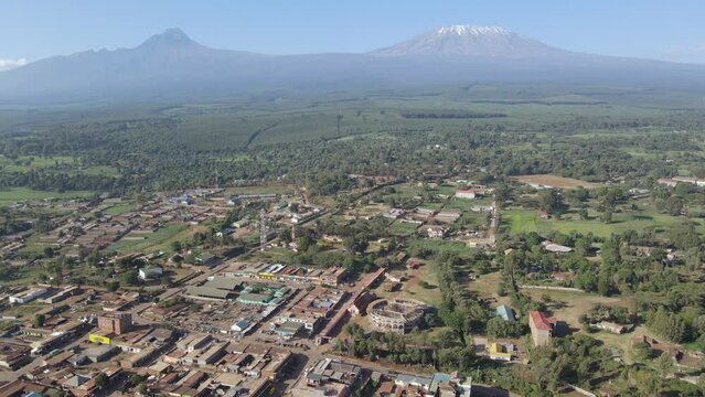 Aerial panorama of developing African town at footstep of Mount Kilimanjaro