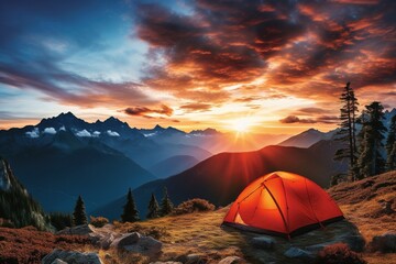 Fototapeta na wymiar Tent in the mountains at sunset. Beautiful summer landscape with a tent.