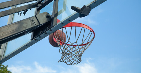 Ball in basketball hoop. Sport. Hobby. Lifestyle