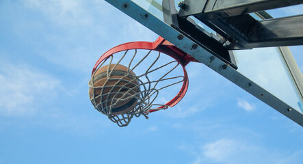 Ball in basketball hoop. Sport. Hobby. Lifestyle