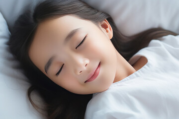Obraz premium Asian little girl sleeping well on white pillow in bed