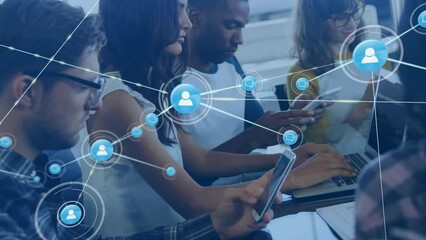 Animation of connected icons over diverse coworkers using cellphone and laptop in office - Powered by Adobe