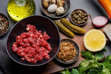 Cooking savory beef tartare and brown bread toasts