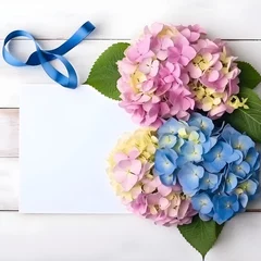 Deurstickers colorful hydrangea flowers on white wooden table for greeting holiday card decor © Oleksiy