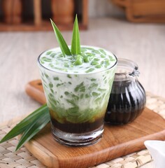 Cendol is a sweet dessert that contains droplets of green rice flour jelly, coconut milk and palm sugar syrup. It is served with shaved ice and is a refreshing snack in hot weather. 