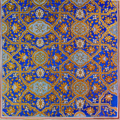 Ornament pattern at the wall of Tilya Kori Madrasa. Gold and blue. Traditional Uzbek decorative art. Samarkand, Uzbekistan