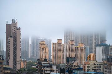 Aerial view of Mumbai city in Maharashtra, India. Beautiful cloudy weather during monsoon. Indian Cityscape.