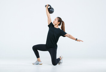 Isolated cutout full body studio shot of strong Asian female fitness athlete sportswoman trainer...