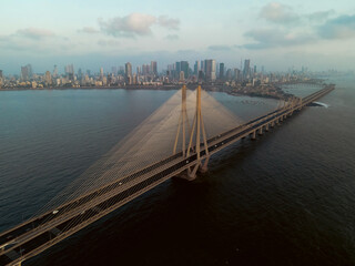 Aerial view of vehicles Passing over Bandra Worli Sea Link in Mumbai, India. Weather in Mumbai, Morning skyline Mumbai. Developing India concept. Longest Bridge in India.