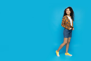 Young attractive girl on a blue background
