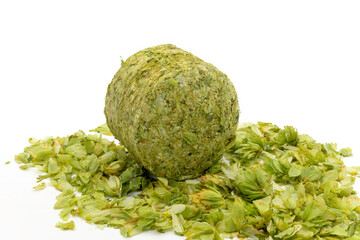 Dried hops - pressed hop puck with hop leafs photographed on white background - Czech hops from the Žatec region - Czech Republic, Europe