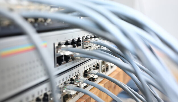 Focus on internet chords and cables perform role of porter of ethernet connection and wi-fi provider at back of modem server Computer technology concept