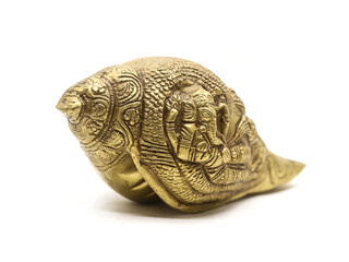 antique ganesha sculpture handcrafted with details on a religious conch shell made of brass used in...