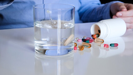 Puting Effervescent Tablet in a Glass of Water. Healthcare concept