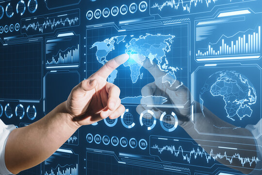 Close up of businessman hand pointing at glowing digital business charts and map interface on blurry background. Military control, warfare and spy concept.