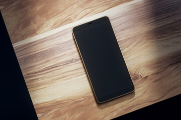 Top view of empty black smartphone on wooden table. Mock up, 3D Rendering.