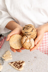 Homemade cookies in female hands, Christmas baking concept.