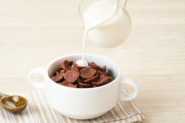 Bowl of cereal chocolate flavor, sweet crunchy 

