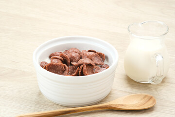 Bowl of cereal chocolate flavor, sweet crunchy 
