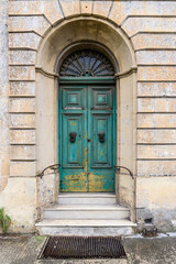 Fototapeta na wymiar Old Maltese wooden door with peeling paint