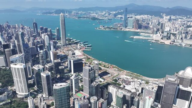 Drone Skyview in Hong Kong 4K Aerial shot of the Wan Chai Central Admiralty Causeway Bay CBD in financial commercial business along the sides of the Victoria Harbour