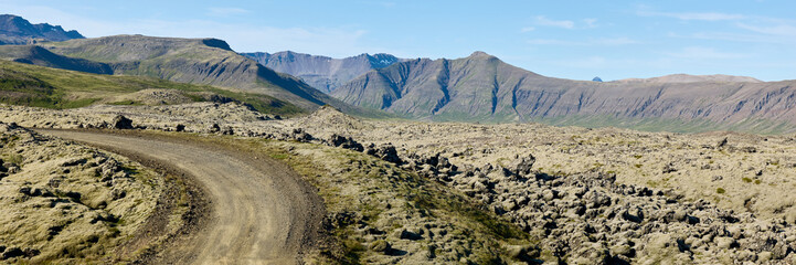 A view of the dirt road among the lava fields. Helgafellssveit, Iceland.