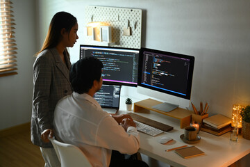 Team of software developers working together for developing website design and coding technologies