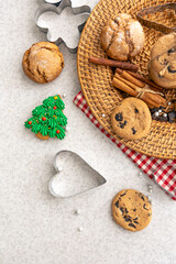 Festive Christmas cookies in a wicker plate on the kitchen table.