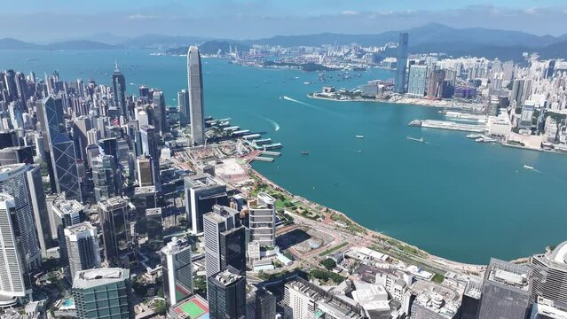 Drone Skyview in Hong Kong 4K Aerial shot of the Wan Chai Central Admiralty Causeway Bay Happy Valley CBD in financial commercial business along the sides of the Victoria Harbour