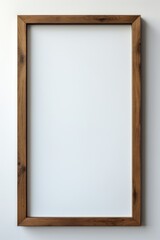 Obraz premium An empty wooden frame on a white wall AI generated illustration