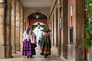 Fototapeta na wymiar Ladies in regional costumes in the center of Aviles, Asturias