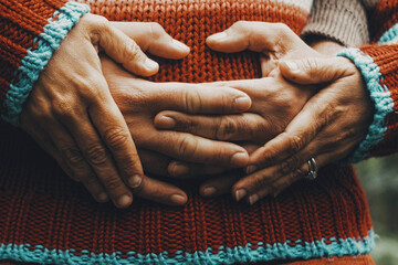 Concept of love and relationship with close up of heterosexual mature couple hugging from back and...