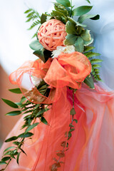 decor made of ribbons and organza fabric, a decorative ball woven from wicker in the color Apricot...