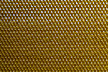 Background texture and pattern of section voshchina of wax honeycomb from a bee hive for filled with honey. Voshchina an artificial basis for the construction of honeycombs, sheet of wax of cells