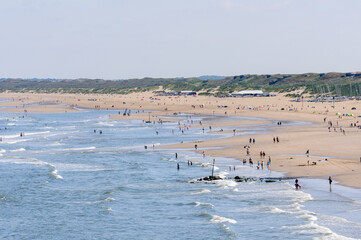 Lots of people enjoying the sunshine at Scheveningen Strand, The Hague, Netherlands.