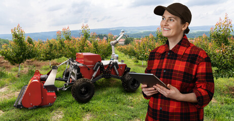 Farmer controls autonomous robot harvester with robotic arm harvesting apples on a smart farm....