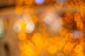 Blurred holiday background with bokeh. Defocused New Year and Christmas illumination