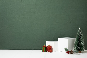 Festive Christmas scene podium for products showcase with abstract green texture background for...