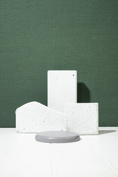 potrait real cylinder pedestal podium set with leaves shadow and lighting. Abstract geometric stage. dark green minimal scene for products showcase, Promotion display. cosmetic mockup. copyspace.