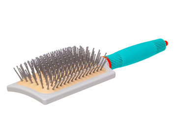 Hairbrush isolated. Closeup of a stylish new green turquoise hair or massage brush or comb...