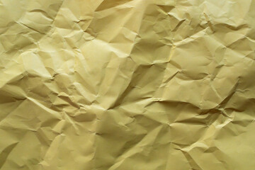 
Crumpled yellow paper as background
