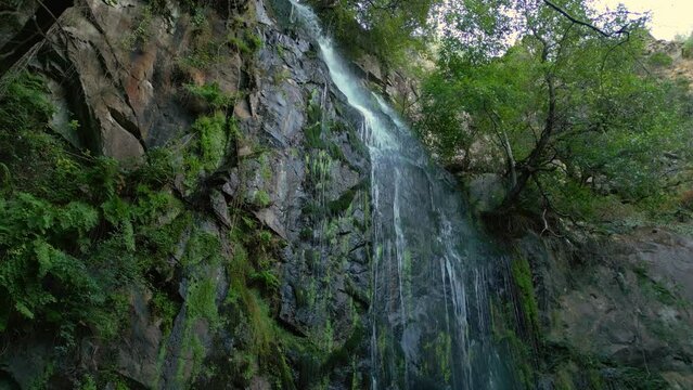 Drone footage of Aguacaida Waterfall (Fervenza de Augacaida) on tropical forest In Panton, Spain