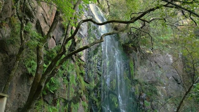 Drone footage of Waterfall of Aguacaida (Fervenza de Augacaida) on tropical forest In Panton, Spain