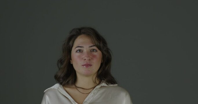 young woman listening, has doubts, then convinced