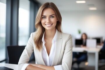 Fototapeta premium portrait of a smiling businesswoman sitting at a desk