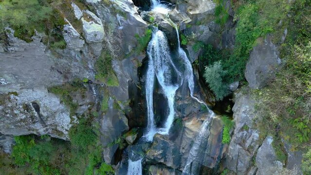 Ascending drone footage of Toxa Waterfall (Fervenza do Toxa) in Silleda town, Pontevedra, Spain