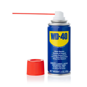 Dnipro, Ukraine -04.11.2023: WD-40 Product for multi purpose use for rusty item. WD-40 Multi-Use Product Spray isolated on white.