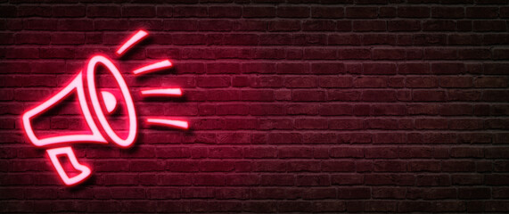 Neon sign on a brick wall - Megaphone
