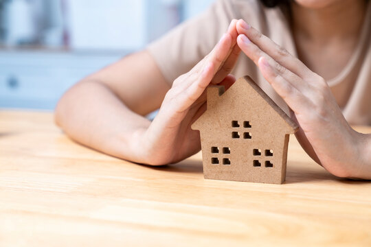 hands protect house, House insurance concept.